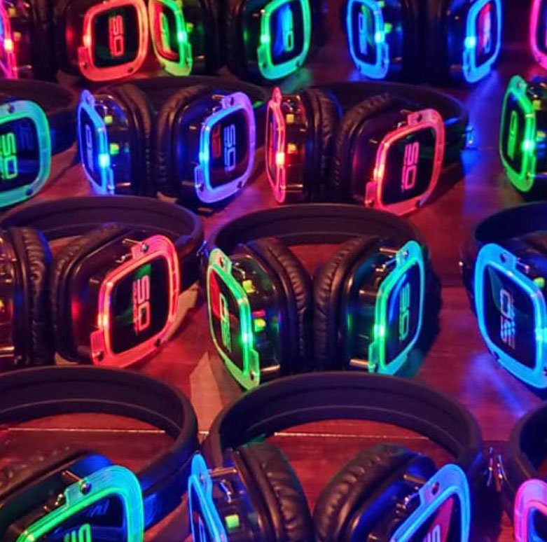 Professional DJ and MC engaging guests at a corporate or wedding event with high-energy music and professional hosting